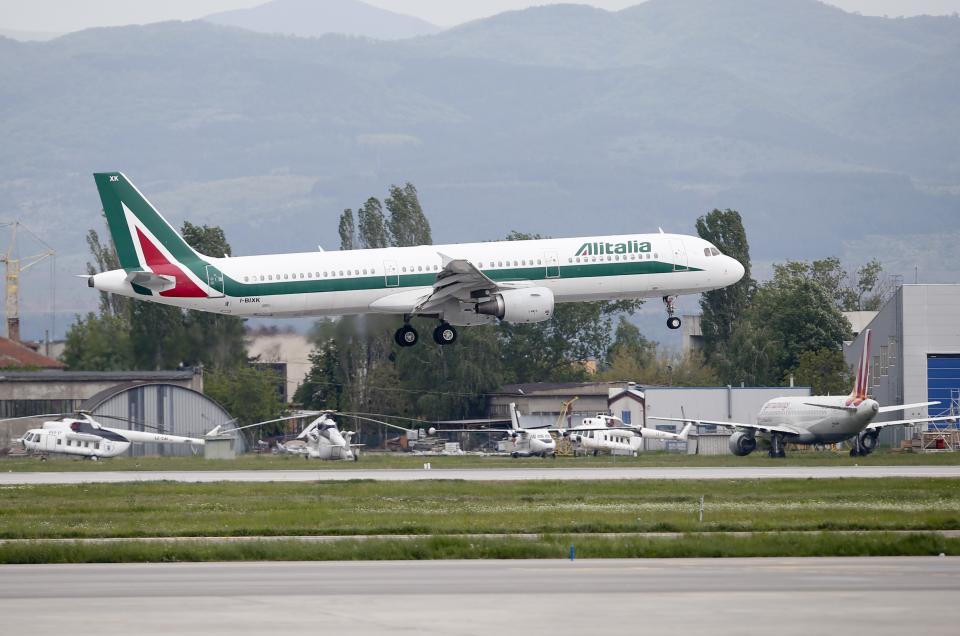 In this photo taken on Sunday, May 5, 2019, an Alitalia plane takes off from Sofia airport, Bulgaria. The Italian government is hoping the Alitalia airline will turn a new page after four private investors expressed an interest in joining the state railway, the Italian treasury and Delta Air Lines in trying once again to relaunch the struggling flagship carrier. (AP Photo/Darko Vojinovic)