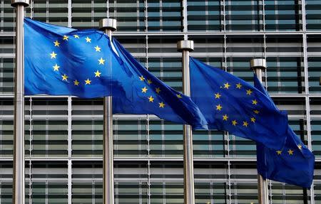 European Union flags flutter outside the EU Commission headquarters in Brussels February 2, 2015. REUTERS/Francois Lenoir