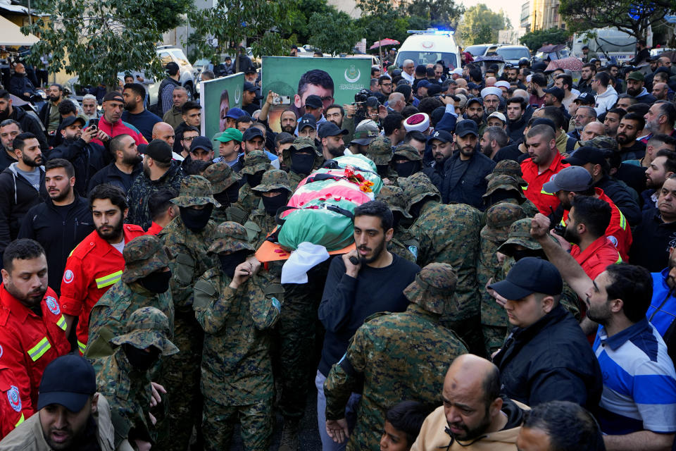 Islamic Group known as Jamaa Islamiya carry the body of their comrade Mohammad Riad Mohyeldin, who was killed in an apparent Israeli strike on Sunday, during his funeral procession in Beirut, Lebanon, Tuesday, March 12, 2024. (AP Photo/Bilal Hussein)