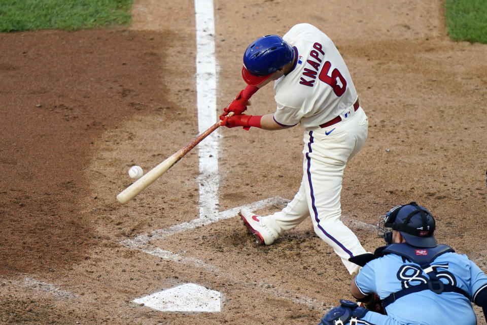 Philadelphia Phillies' Andrew Knapp hits a two-run triple off Toronto Blue Jays pitcher Thomas Hatch during the first inning of the fifth baseball game in a doubleheader, Friday, Sept. 18, 2020, in Philadelphia. (AP Photo/Matt Slocum)