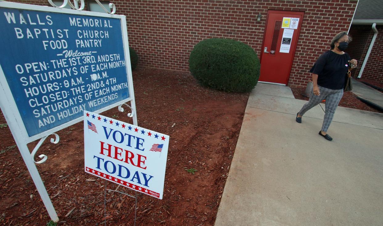 Lisa Borders leaves after casting her vote early Tuesday morning, Nov. 2, 2021, at Walls Memorial Baptist Church on Elizabeth Avenue near Shelby.