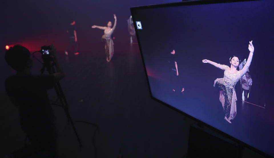 Indonesian dancer Nala Amyrtha performs during a video recording for '"Saweran Online" program on Indonesia Dance Network YouTube channel, at EKI Dance Company studio in Jakarta, Indonesia Thursday, May 14, 2020. Two Indonesian choreographers are helping fellow dancers who lost their jobs due to the new coronavirus outbreak in the country by setting up aYouTube channel as a platform where dancers, choreographers and dance teachers can perform, then receive donation from viewers. (AP Photo/Achmad Ibrahim)