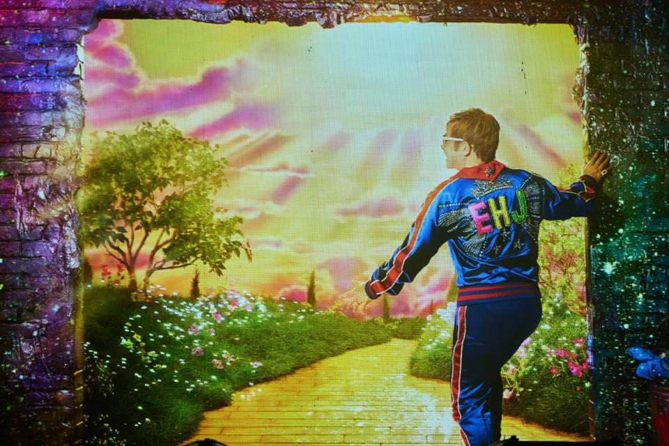 The screen showing Elton John and a yellow brick road is shown before he takes the stage for his "Farewell Yellow Brick Road The Final Tour" on Friday, Nov. 11, 2022, at Chase Field in Phoenix.