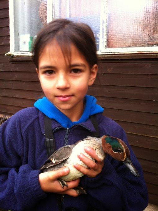 Family photo of Mya-Rose at a younger age holding a duck (PA)