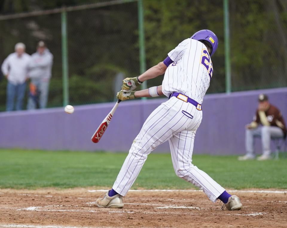 Clarkstown North's Kaden Miller (22) connects with a pitch during baseball action against Clarkstown South at Clarkstown North High School on Tuesday, April 25, 2023. 