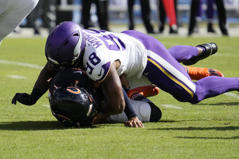 Minnesota Vikings linebacker D.J. Wonnum (98) sacks Chicago Bears quarterback Justin Fields during the first half of an NFL football game, Sunday, Oct. 15, 2023, in Chicago. (AP Photo/Nam Y. Huh)