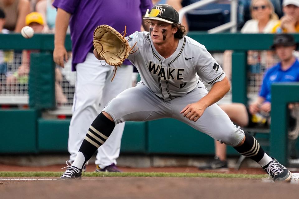 Jun 21, 2023; Omaha, NE, USA; Wake Forest Demon Deacons first baseman Nick Kurtz (8) gets an out during the first inning against the LSU Tigers at Charles Schwab Field Omaha. Mandatory Credit: Dylan Widger-USA TODAY Sports