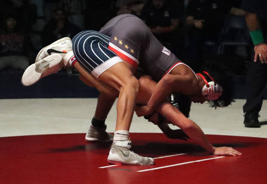 Buchanan High 128-pound wrestler Joseph Toscano has control over Bakersfield High’s Aiden Simmons in his 3-0 victory in the CIF Central Section wrestling championships at Buchanan High on Feb. 18, 2023.