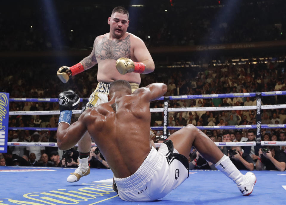 Andy Ruiz knocks down Anthony Joshua during the third round of a heavyweight title boxing match Saturday, June 1, 2019, in New York. Ruiz won in the seventh round. (AP Photo/Frank Franklin II)