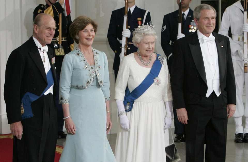 President Bush and first lady Laura Bush line up for photos with Queen Elizabeth II and Prince Philip.