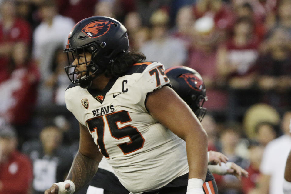 FILE - Oregon State offensive lineman Taliese Fuaga follows a play during the second half of an NCAA college football game against Washington State, Saturday, Sept. 23, 2023, in Pullman, Wash. Fuaga has been selected to The Associated Press midseason All-America team, Wednesday, Oct. 18, 2023. (AP Photo/Young Kwak, File)