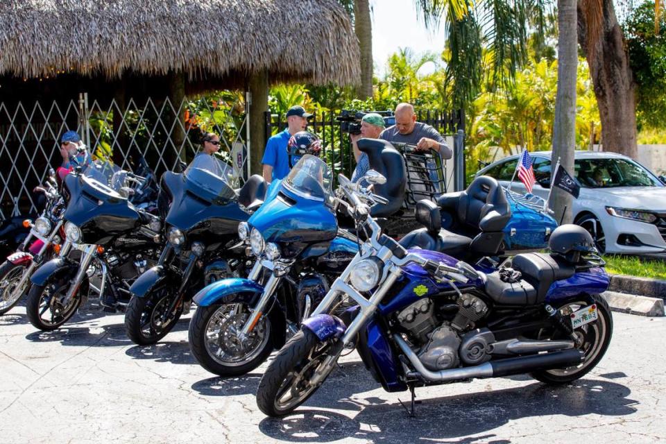 Veterans park up after riding their motorcycles from Marathon to Peterson’s Harley-Davidson South as part of a Wounded Warrior Project mental health program, “Rolling Project Odyssey”, in Cutler Bay, Florida, on Tuesday, October 12, 2021. The group stopped at the Harley-Davidson dealer to get a tour of the facilities.