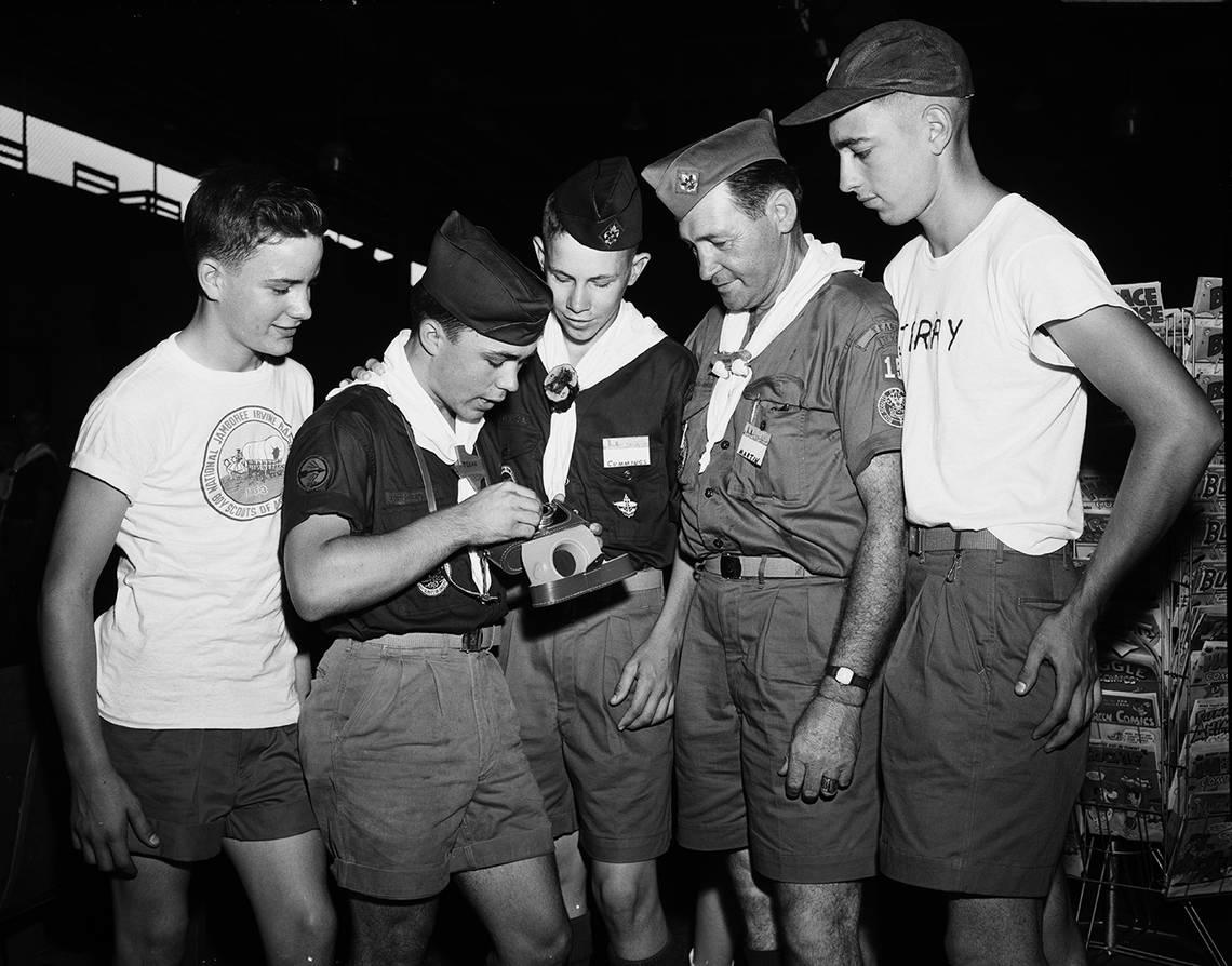 July 8, 1953: Five Boy Scouts study the camera they will use to record events during the national Boy Scout Jamboree in California. The boys stopped in Fort Worth en route to the jamboree. Left to right, Ray Green, 13, of Cameron; Tommy Massey, 16, of Teague; Bob Cummings, 16, of Gatesville; Jim Martin of Teague, scoutmaster, and Jerry Gritter, 16, of Waco. Fort Worth Star-Telegram archive/UT Arlington Special Collections