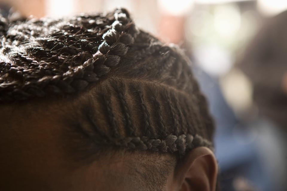 <h1 class="title">The top of a mans head with cornrows</h1><cite class="credit">Getty Images</cite>