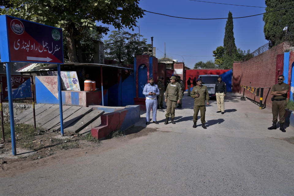 Police officers stand guard outside the Adiyala prison, where the special court hearing of Cipher case against Pakistan's former Prime Minister Imran Khan, is held at the Adiyala prison, in Rawalpindi, Pakistan, Monday, Oct. 23, 2023. A Pakistani court on Monday indicted Khan on charges of revealing official secrets after his 2022 ouster from office in another slap to the former prime minister who will likely be unable to run in the upcoming parliamentary elections in late January. (AP Photo/Anjum Naveed)