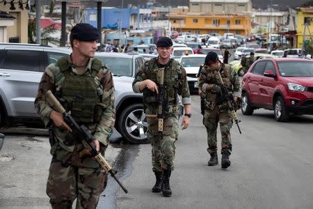 Dutch soldiers patrol the streets of Sint Maarten Dutch part of Saint Martin island in the Carribean after the Hurricane Irma September 7, 2017. Netherlands Ministry of Defence-Gerben van Es/Handout via REUTERS