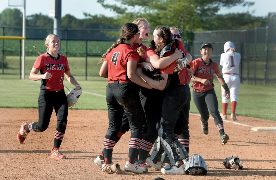 Mt. Zion players celebrate winning over Glenwood Friday, June 2, 2023.