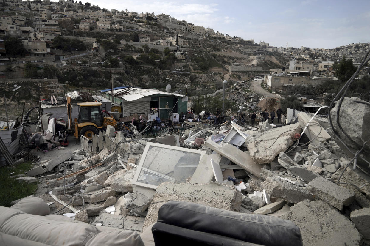 The Ratib Matar family home lies in rubble after it was demolished by Israeli authorities in the Jabal Mukaber neighborhood of east Jerusalem, Sunday, Jan. 29, 2023. For many Palestinians, the accelerating pace of home demolitions is part of Israel's new ultranationalist government's broader battle for control of east Jerusalem, claimed by the Palestinians as the capital of their future state. Israel says it is simply enforcing building regulations. (AP Photo/Mahmoud Illean)