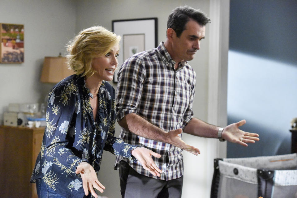 This image released by ABC shows Julie Bowen, left, and Ty Burrell in a scene from the series finale of "Modern Family." The popular comedy series ends its 11-season run with a two-hour finale on Wednesday. (Bonnie Osborne/ABC via AP)