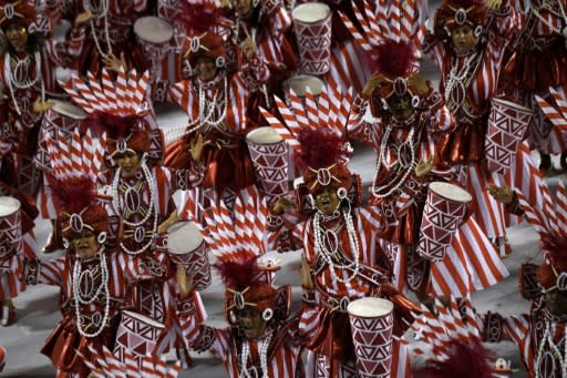 Members of the Viradouro samba school perform during the first night of Rio's carnival parade at the Sambadrome