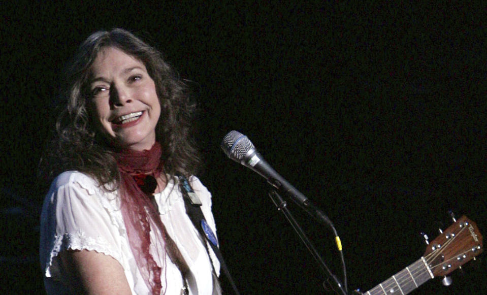 FILE - Nanci Griffith performs during the ACLU Freedom Concert Oct. 4, 2004, in New York. Griffith, the Grammy-winning folk singer-songwriter from Texas whose literary songs like “Love at the Five and Dime” celebrated the South, has died. She was 68. A statement from her management company on Friday, Aug. 13, 2021, confirmed her death, but no cause of death was provided. (AP Photo/Julie Jacobson, File)