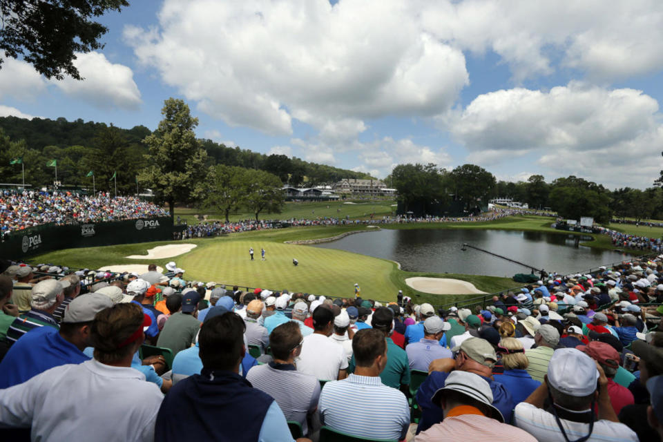<p>Fans watch as golfers play not he fourth green during the second round of the PGA Championship golf tournament at Baltusrol Golf Club in Springfield, N.J., July 29, 2016. (Photo: Tony Gutierrez/AP)</p>