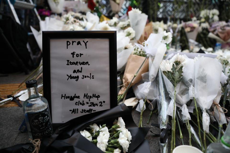 A woman pays tribute for the victims of the Halloween celebration stampede, on the street near the scene on 31 October 2022 in Seoul, South Korea (Getty Images)