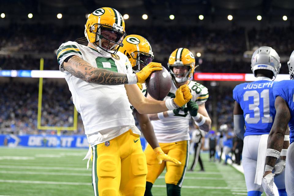 Green Bay Packers wide receiver Christian Watson (9) celebrates after scoring a touchdown against the Detroit Lions in the third quarter on Thursday, Nov. 23, 2023, at Ford Field. Watson caught a team-high five receptions and 95 yards, along with the TD.