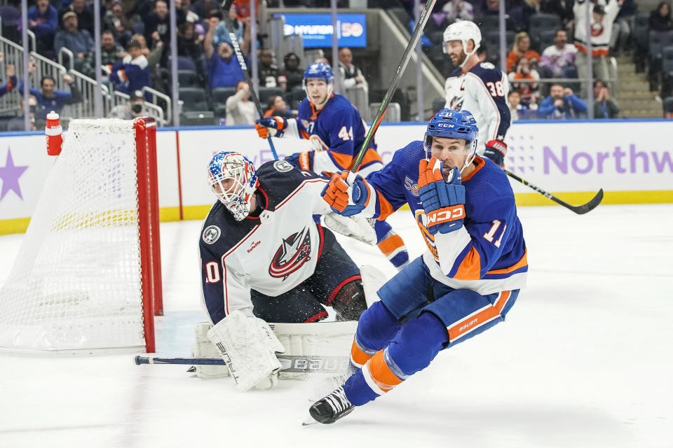 New York Islanders left wing Zach Parise (11) reacts after scoring a goal during the extra period of an NHL hockey game against the Columbus Blue Jackets, Saturday, Nov. 12, 2022, in Elmont, N.Y. New York Islanders won 4-3. (AP Photo/Eduardo Munoz Alvarez)