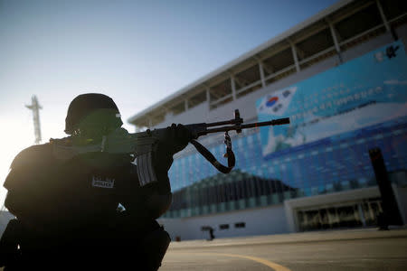 A South Korean police officer takes part in a security drill ahead of the 2018 Pyeongchang Winter Olympic Games at the Olympic Stadium, the venue for the opening and closing ceremony in Pyeongchang, South Korea December 12, 2017. REUTERS/Kim Hong-Ji/Files