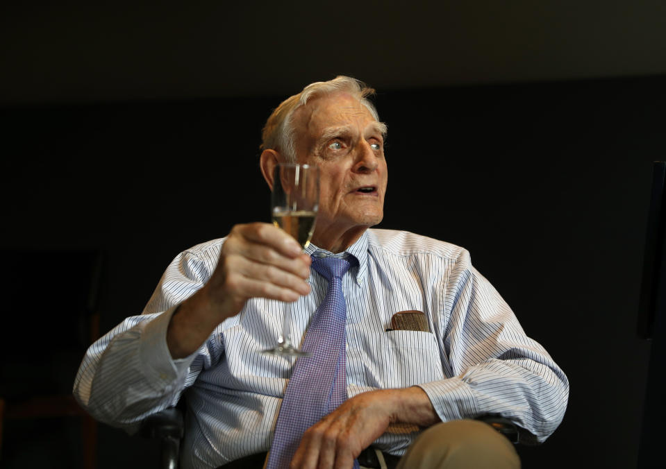 Nobel chemistry winner John B. Goodenough poses for the media at the Royal Society in London, Wednesday, Oct. 9, 2019. The 2019 Nobel Prize in Chemistry has been awarded to John B. Goodenough, M. Stanley Whittingham and Akira Yoshino for the development of lithium-ion batteries. (AP Photo/Alastair Grant)