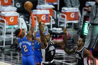 Oklahoma City Thunder guard Shai Gilgeous-Alexander (2) takes a shot against Los Angeles Clippers center Serge Ibaka (9) during the first quarter of an NBA basketball game Sunday, Jan. 24, 2021, in Los Angeles. (AP Photo/Ashley Landis)