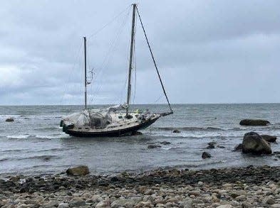 Three people were rescued after a sailboat ran aground off Plymouth on Wednesday, Dec. 6, 2023.