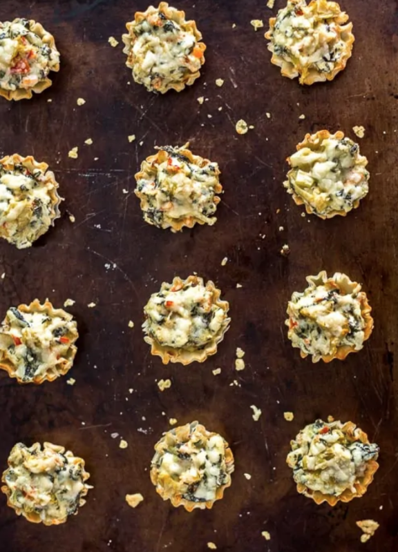 <p>Plating Pixels</p><p>These mini parmesan spinach phyllo cup appetizers make entertaining easy. Crisp phyllo cups filled with Parmesan spinach dip, bell peppers, artichoke hearts and Parmesan cheese.</p><p><strong>Get the recipe: <a href="https://www.platingpixels.com/mini-parmesan-spinach-phyllo-cup-appetizers/" rel="nofollow noopener" target="_blank" data-ylk="slk:Mini Parmesan Spinach Phyllo Cup Appetizers;elm:context_link;itc:0;sec:content-canvas" class="link rapid-noclick-resp"><em>Mini Parmesan Spinach Phyllo Cup Appetizers</em></a></strong></p>