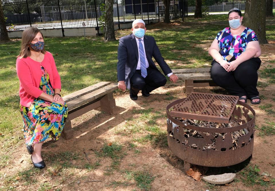 Rabbi Vered Harris, spiritual leader of Temple B'nai Israel, left, on the grounds of her temple, along with Rabbi Abby Jacobson, spiritual leader of Emanuel Synagogue, right, and Imad Enchassi, senior imam of the Islamic Society of Greater Oklahoma City, middle.