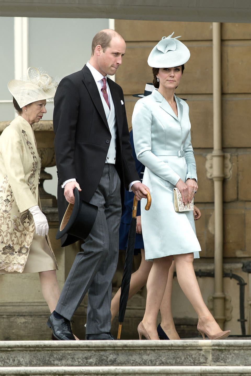 <p>The Duchess wears a pale blue Christopher Kane silk satin coatdress and matching John Lock and Co hat, embroidered clutch and suede nude pumps at a garden party at Buckingham Palace.</p>