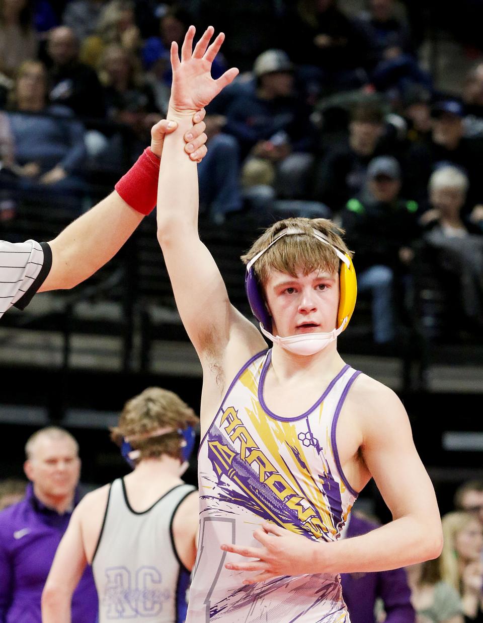 Watertown junior 120-pounder Sloan Johanssen uses three fingers to single the number of state A championships he has won on Friday, Feb. 24, 2023 in the South Dakota State Wrestling Championships at Rapid City.