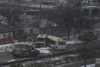 FILE - Russian's army tanks move down a street on the outskirts of Mariupol, Ukraine, March 11, 2022. (AP Photo/Evgeniy Maloletka, File)