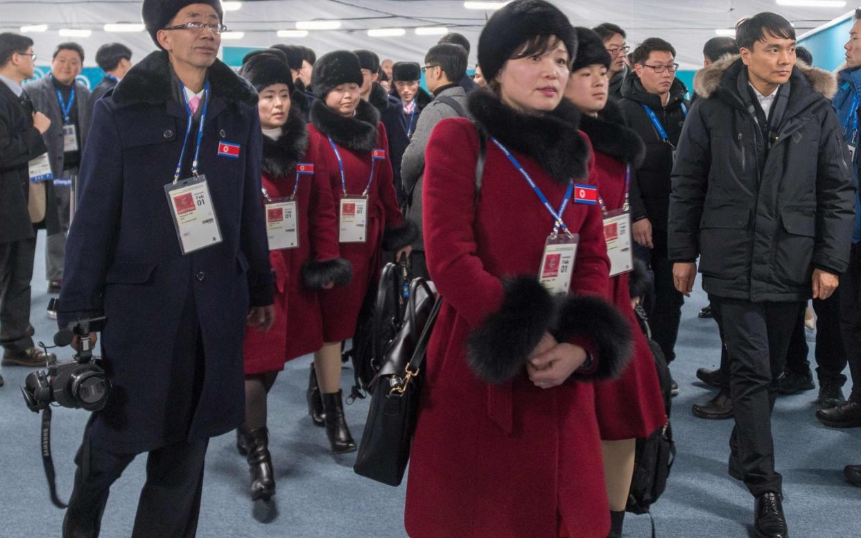 Members of a North Korean delegation of 32 people, including 10 athletes of the North Korean Olympic team, arrive at the Athletes' Olympic Village in Gangneung  - AFP