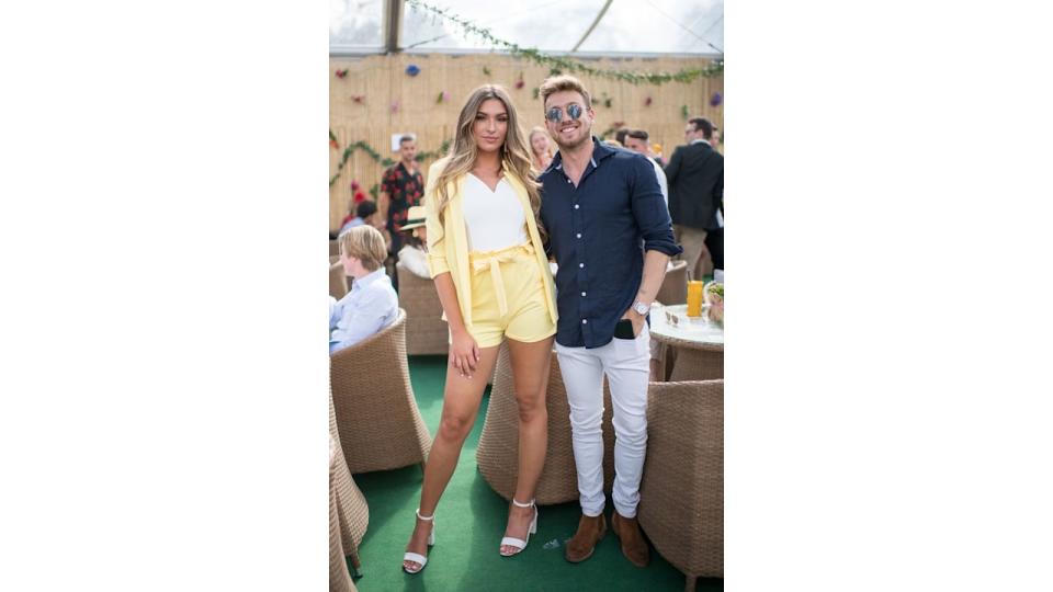 Zara McDermott in a yellow short suit and Sam Thompson in a blue shirt and sunglasses