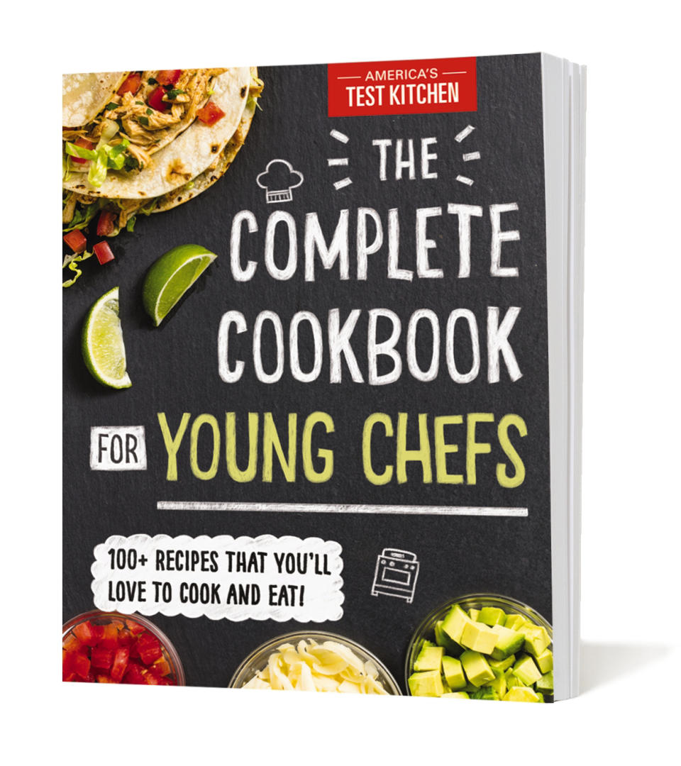 This image provided by America's Test Kitchen in January 2019 shows the cover for the cookbook "Complete Cookbook for Young Chefs." It includes a recipe for Real Buttered Popcorn. (America's Test Kitchen via AP)