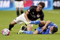 AC Milan's Andrea Poli (L) and Empoli's Mario Rui fight for the ball during their Serie A soccer match at San Siro stadium in Milan, August 29, 2015. REUTERS/Giampiero Sposito