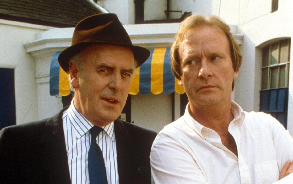 Dennis Waterman, right, as Terry McCann with George Cole as Arthur Daley in Minder - Rex Features