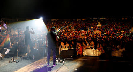 FILE PHOTO:Hamed Sinno (L), the lead singer of Lebanese alternative rock band Mashrou' Leila performs during the Ehdeniyat International Festival in Ehden town, Lebanon August 12, 2017. REUTERS/Jamal Saidi/File Photo