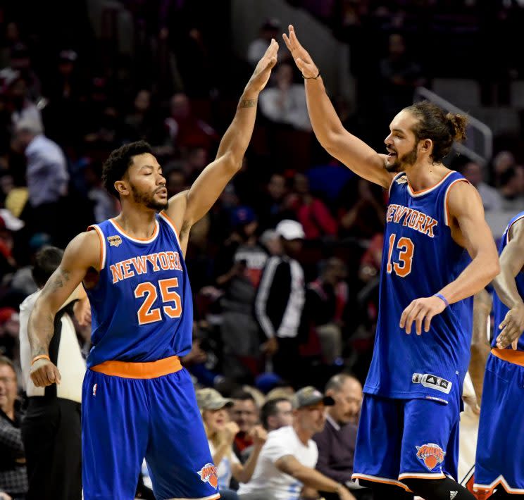 Derrick Rose and Joakim Noah celebrate another win at the United Center. (Associated Press)