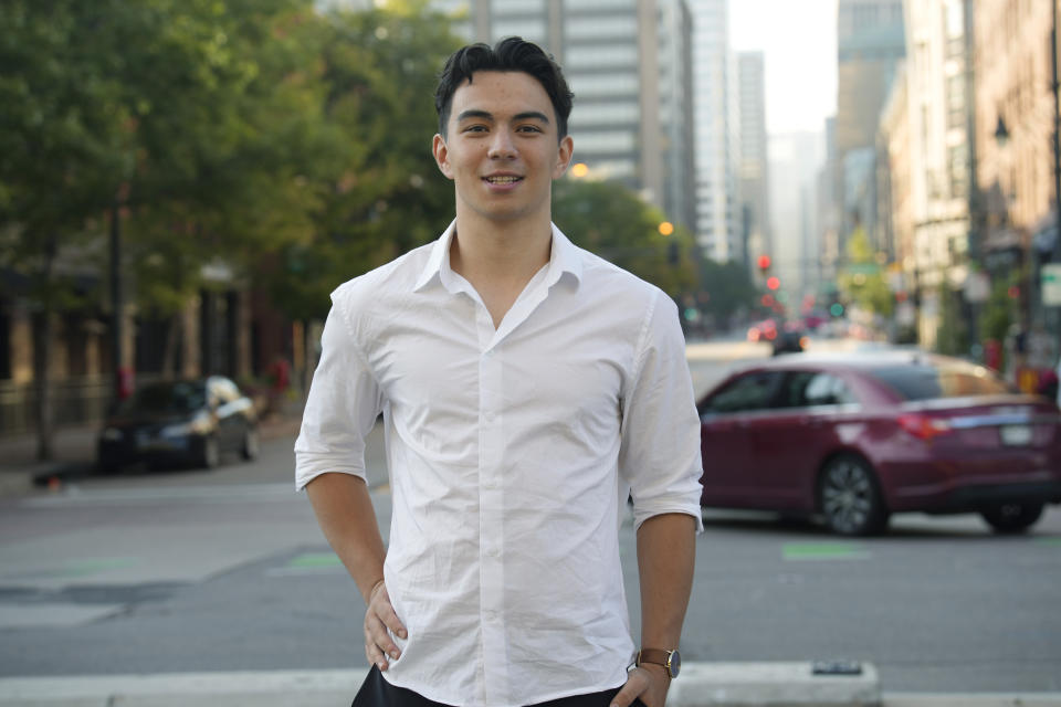 Ronan Takizawa, a student at Colorado College in Colorado Springs, Colo., is shown outside Union Station on the way to boarding a bus for his 65-mile commute to class from downtown Denver early Monday, Aug. 7, 2023, in Denver. (AP Photo/David Zalubowski)