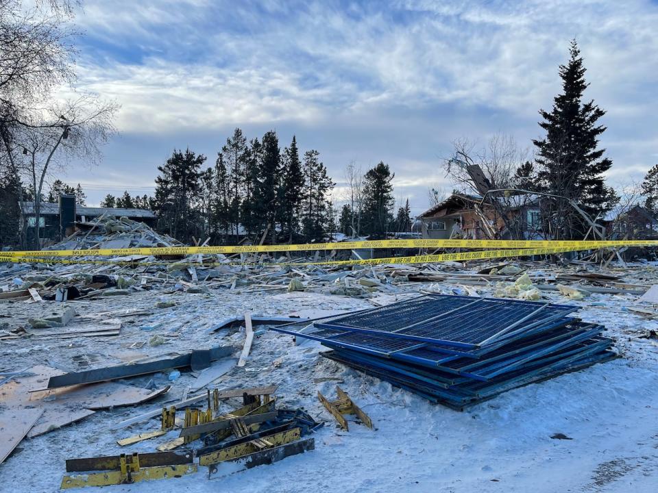 Scattered debris on the property where a house exploded in Whitehorse on Nov. 14, 2023.