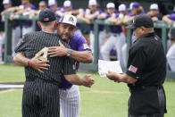 Vanderbilt head coach Tim Corbin (4) hugs East Carolina head coach Cliff Godwin before an NCAA college baseball super regional game Friday, June 11, 2021, in Nashville, Tenn. (AP Photo/Mark Humphrey)