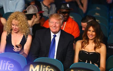 May 2, 2015; Las Vegas, NV, USA; Donald Trump (middle) and wife Melania Trump (right) in attendance before the welterweight boxing fight between Floyd Mayweather and Manny Pacquiao at the MGM Grand Garden Arena. Mandatory Credit: Mark J. Rebilas-USA TODAY Sports - RTX1BAIQ