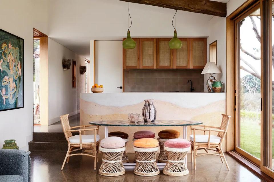 dining table next to a shaded concrete wall